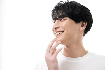 Very easy to use whitening and white teeth cosmetic image of an Asian male Close-up of profile