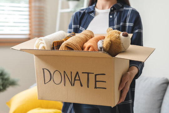 Recycling, Donation For Poor, Asian Young Woman Pack, Hand In Holding Donate Box Full With Second Hand Clothes, Charity Helping And Needy People. Reuse Recycle, Moving Of Object On White Background.