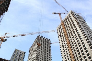 Crane and building construction site. Industry modern new civil house business. Concept of development improvement town. Architecture planning of a city. Renovation project. Residential area