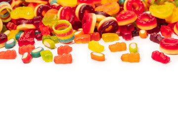Assorted colorful gummy candies. Top view. Jelly donuts. Jelly bears. Isolated on a white background.