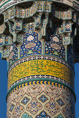 Beautiful detail of Islamic calligraphy quoting the Koran  and design on the minaret of the  Mosque...