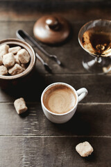 Cup of coffee on rustic wooden background. Copy space.