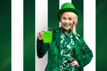 St. Patrick's Day celebration. Beautiful smiling woman wearing green hat witn a glass of beer.