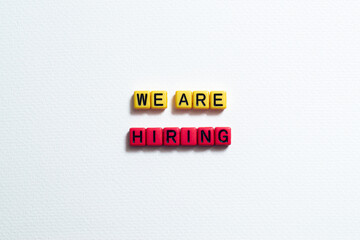 We are hiring - word concept on cubes, text