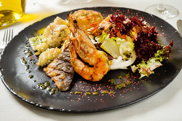 grilled seafoods with lemon and sauce