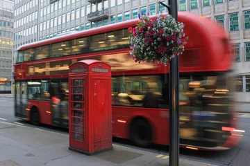 Fotobehang Double Decker Bus in motion on London streets with Telephone Booth © IzzetSafer