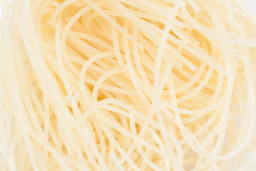 Intricate patterns of boiled noodles.