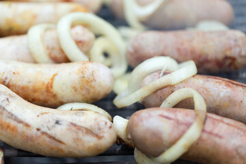 Delisious grilled sausage and onions rings.