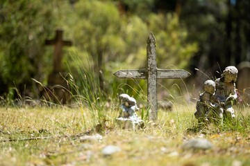 cemetery graves and cross in a graveyard in australia
