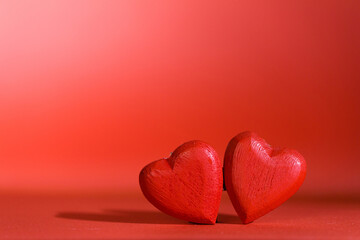 Two hearts on red background