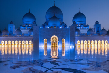 Symmetrical close up view during the blue hour of the majestic Sheik Zayed mosque in Abu Dhabi