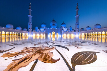 Symmetrical view during the blue hour of the majestic Sheik Zayed mosque in Abu Dhabi shot using a...