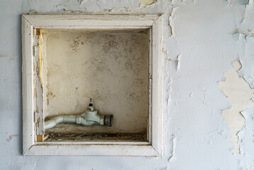 Broken of the old fire hose cabinet on the wall
