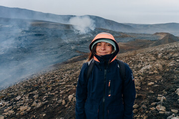 tourist on Fagradalsfjall, Iceland - June, 2021: volcano eruption near Reykjavik, Iceland