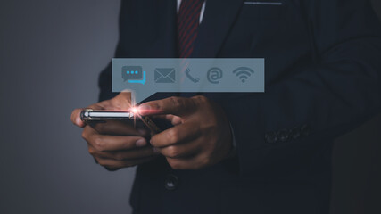 Businessman access contact connect online by smartphone with contact icons.