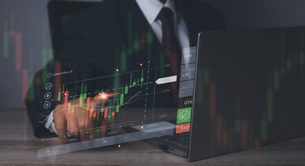 Stock market graph with man working stock trading computer screen background.