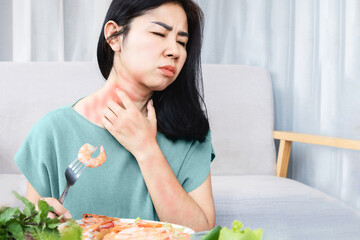 Asian woman have allergy reactions to shrimp or seafood have problems with rash, itching, and hives on the skin - obrazy, fototapety, plakaty