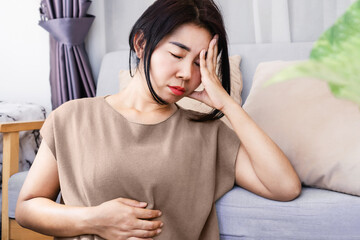 Gut-Brain Axis and anxiety concept with stress Asian woman have problems with digestion systems,...