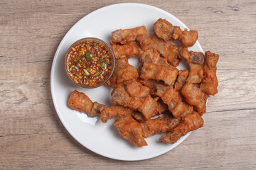 Deep fried pork belly with fish sauce and spicy dipping sauce