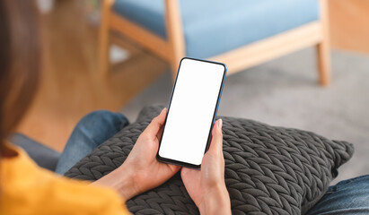 Hand holding smartphone mockup of blank screen. Take your screen to put on advertising.