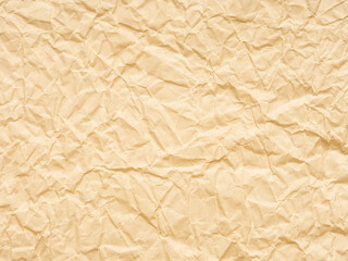 Extra soft beige or yellow crumpled paper texture. Blank grunge page or sheet for interior and exterior decoration. Empty background for handcrafts, xmas designs, text, lettering, screen saver.