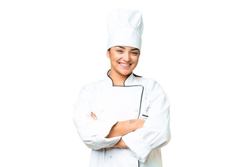 Young woman Chef over isolated chroma key background keeping the arms crossed in frontal position