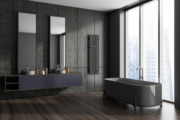 Grey bathroom interior with washbasins and bathtub near window
