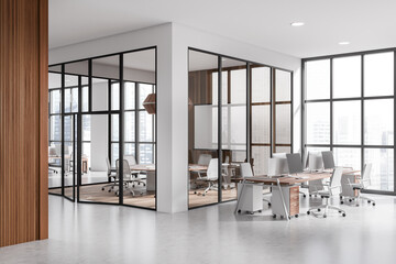Light business room interior with coworking and meeting area, panoramic window