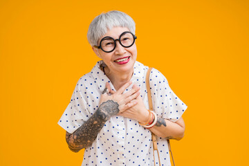 cheerful smiling asian senior woman wear glasses grey hair in casual cloth portrait headshot on...
