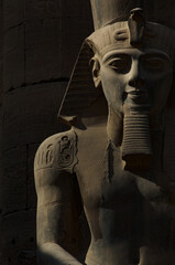 Portrait statue of Ancient Egyptian Pharaoh Ramses at Luxor Temple beside the River Nile in Egypt  
