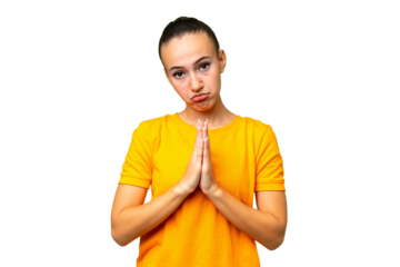 Young Arab woman over isolated background keeps palm together. Person asks for something