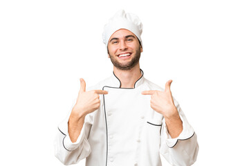 Young handsome chef man over isolated background proud and self-satisfied