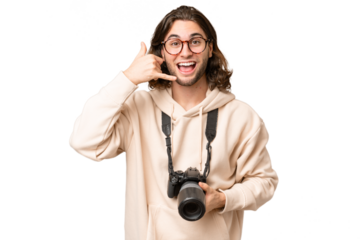 Young photographer man over isolated background making phone gesture. Call me back sign