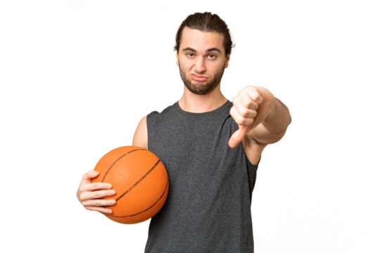 Young basketball player man over isolated background showing thumb down with negative expression