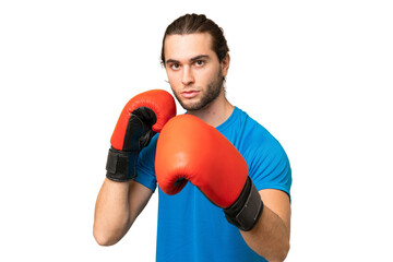 Young handsome man isolated on green chroma background with boxing gloves