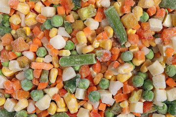 Mexican Mix of frozen vegetable containing carrots, peas, corn, background, texture
