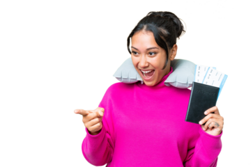 Young Uruguayan woman holding a passport over isolated chroma key background pointing finger to the side and presenting a product