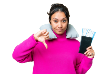Young Uruguayan woman holding a passport over isolated chroma key background showing thumb down with negative expression