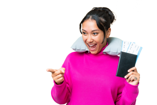 Young Uruguayan woman holding a passport over isolated chroma key background pointing finger to the side and presenting a product