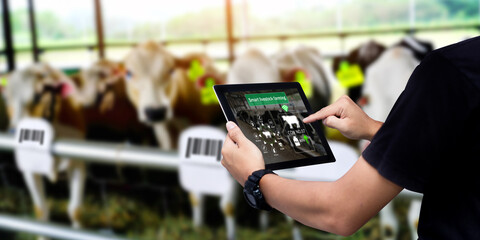 Smart warehouse management system.Worker hands holding tablet on blurred warehouse as background