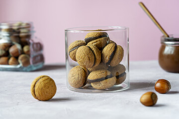 Hazelnut biscuits baci di dama or lady's kisses are traditional Italian dessert made as a sandwich...