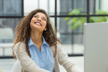 Smiling businesswoman looking at camera, make conference or business call, recording video blog, talking with client.