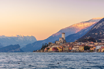 The village and castle of Malcesine sul Garda at sunset
