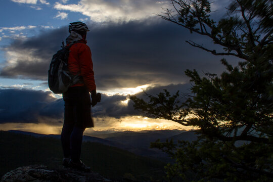 Man looking at view of sunset at Lolo Peak, Selway-Bitterroot Wilderness, Lolo National Forest, Montana, USA