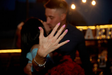 Happy Woman Shows  Engagement Ring After Proposal