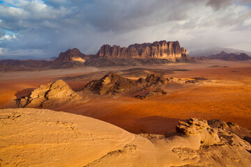 Red sand desert and sandstone cliffs in Wadi Rum, Jordan.