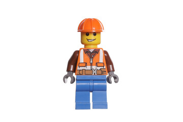 Naklejka premium Russia Vyborg 01.14.2023 Lego figurine worker in a helmet isolated on white background