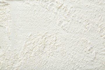 Rice flour close up background. A pile of Rice flour on a white background. Spilled flour. Flour texture
