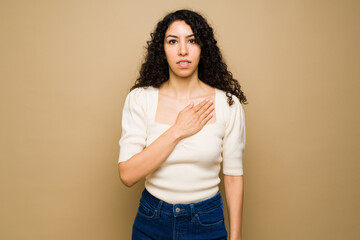 Young woman using sign language saying please