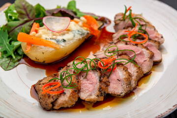 Plate with duck breast and pear, duck L'Orange